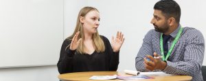 A female student talking to a male Academic Tutor