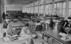 Students sat in the library in the past.