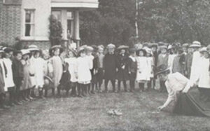 Miss Chattaway teaching a group of pupils outside