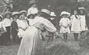 Miss Chattaway teaching a group of pupils outside