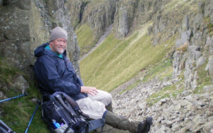 Brian Heathcote sat in Peak District
