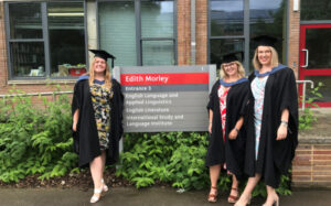 Katie Lawman and two friends outside Edith Morley building at graduation