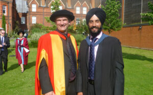 Gurinder with a friend at graduation