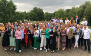 A group of alumni at a reunion on Whiteknights Campus