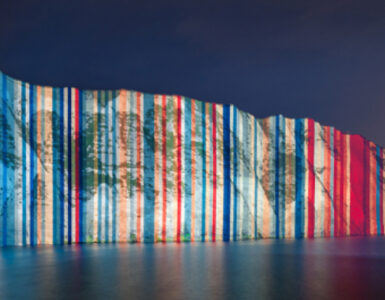 Climate stripes projected onto the White Cliffs of Dover