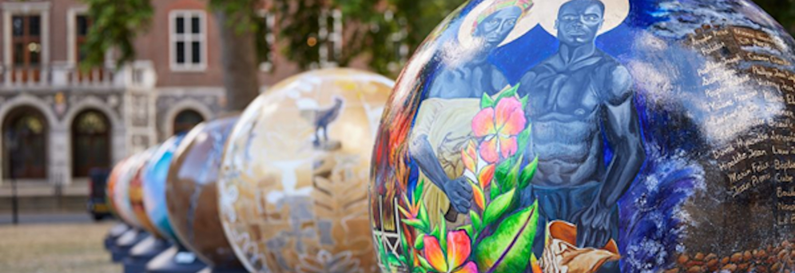 A trail of globes with artwork on