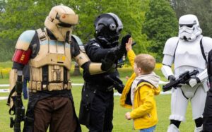 A boy meeting stormtroopers at the Community Festival