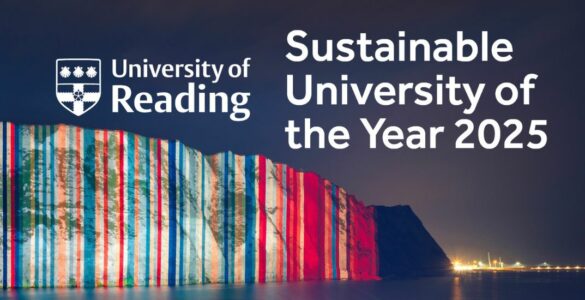 The climate stripes projected onto the White Cliffs of Dover with a textbox saying Sustainable University of the Year