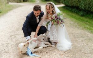 Romy and Rhys with their dog on their wedding day