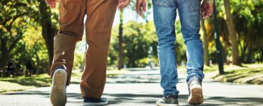 Two men walking away from the camera