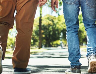 Two men walking away from the camera