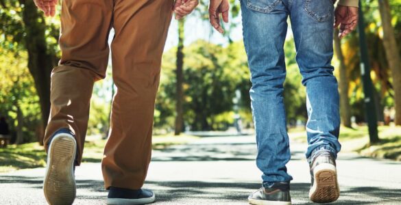 Two men walking away from the camera