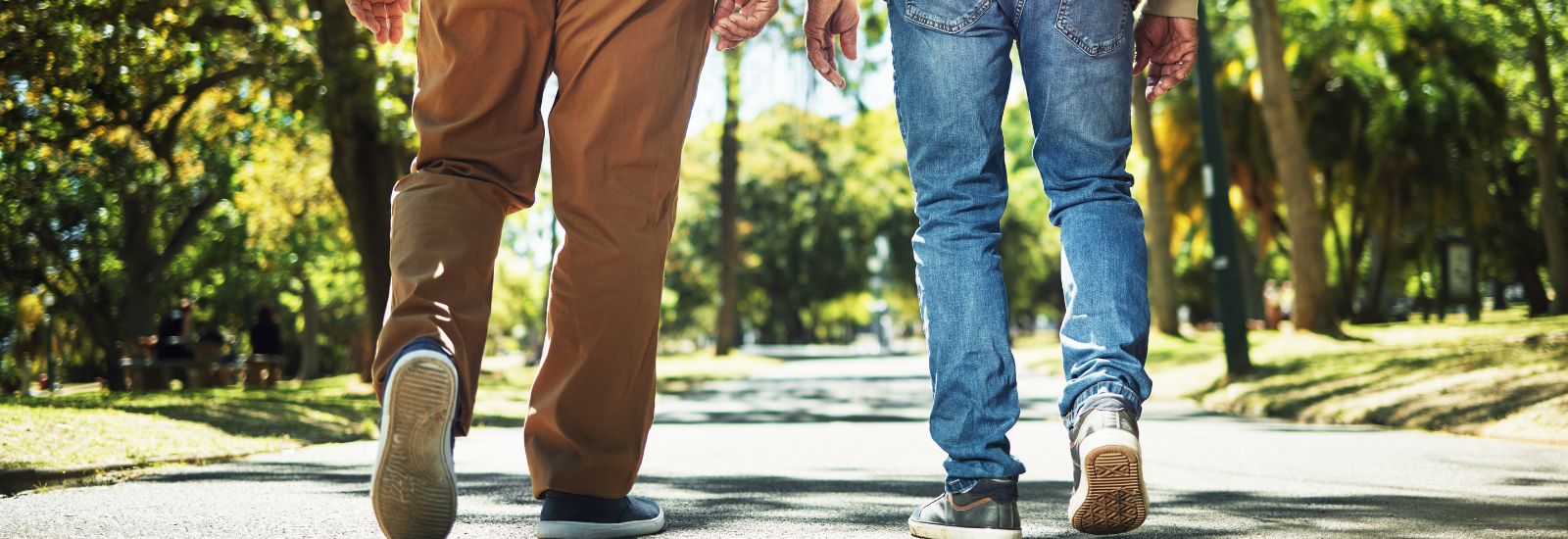 Two men walking away from the camera