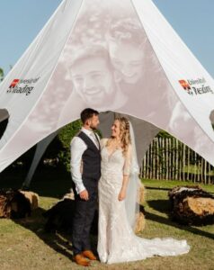 Romy and Rhys on their wedding day with the gazebo