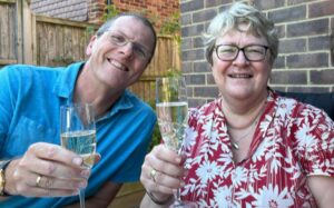 Paul and Anne raising a toast