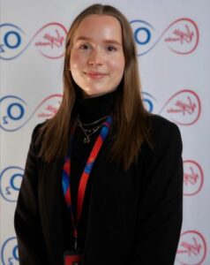 Sophie Lupton against a background with the Virgin Media O2 logo