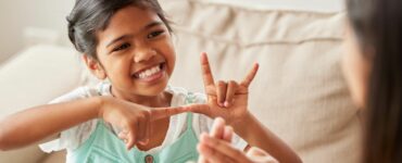Girl communicating using sign language