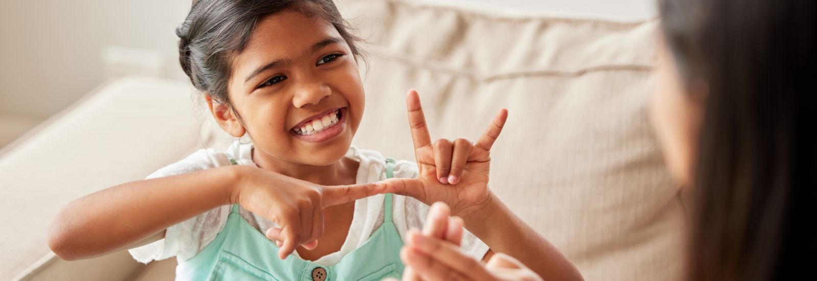 Girl communicating using sign language