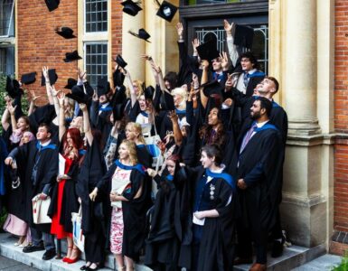 Graduates throwing caps in air