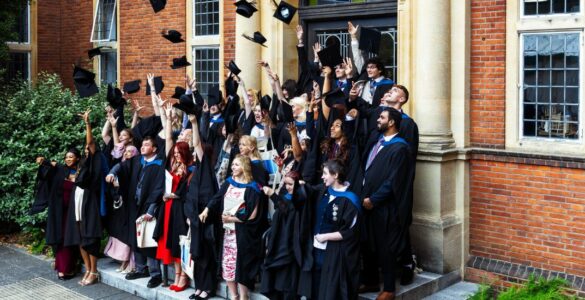 Graduates throwing caps in air