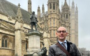 Image of Pete outside the Houses of Parliament 