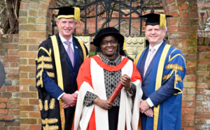 Chancellor and Vice Chancellor with Cecily receiving her Honorary Doctorate