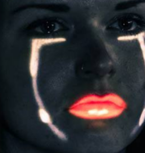 Artwork by Rosanna McNamara photo of her face with light used to emphasise lips and lines on her face