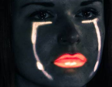 Artwork by Rosanna McNamara photo of her face with light used to emphasise lips and lines on her face