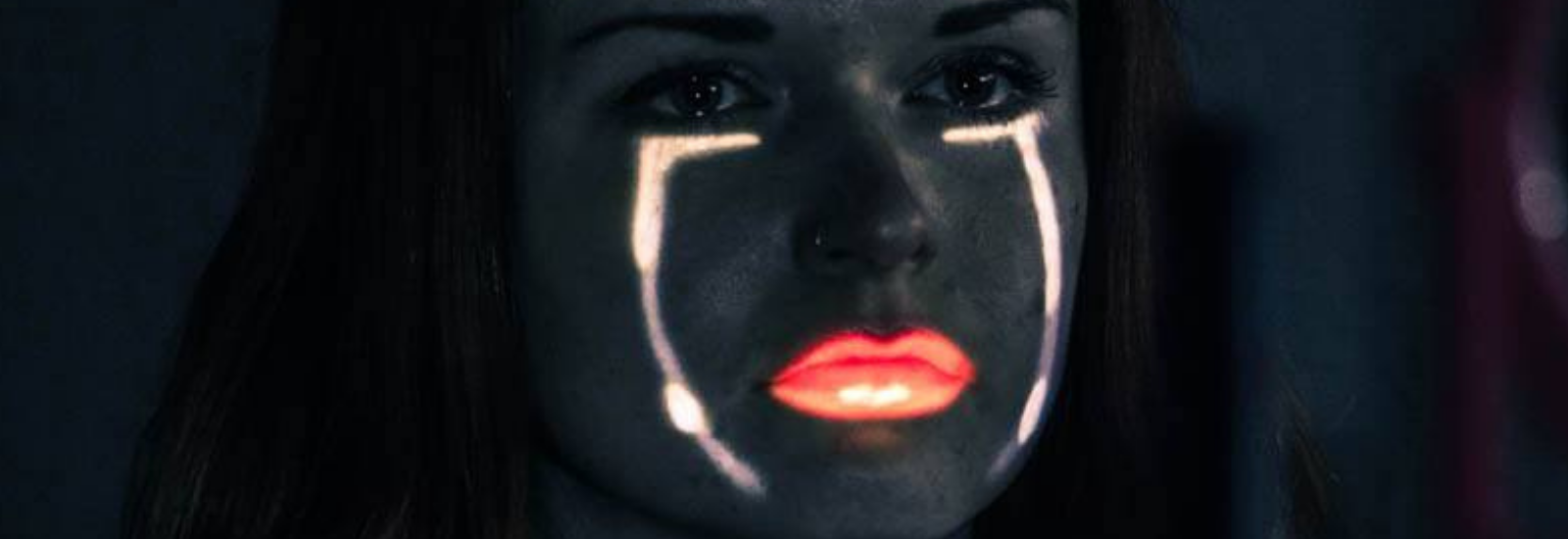 Artwork by Rosanna McNamara photo of her face with light used to emphasise lips and lines on her face