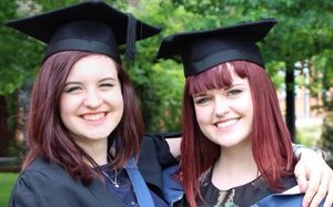 Rosanna and her friend in cap and gown for graduation at Reading
