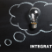 A metaphorical light bulb drawn on a blackboard with the caption 'Integration'