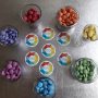 Bowls of coloured sweets displayed to replicate the EMA logo