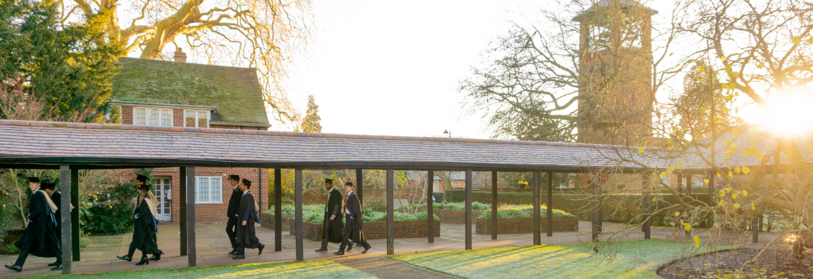 Graduates walk across London Road campus