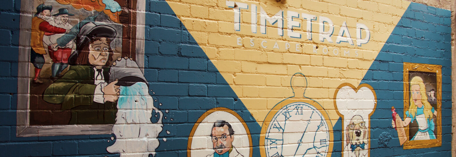 A brick wall advertising Time Trap escape rooms