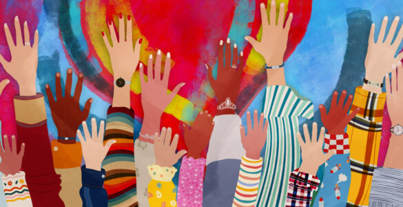 Group of diverse people with arms and hands raised towards a hand painted heart.