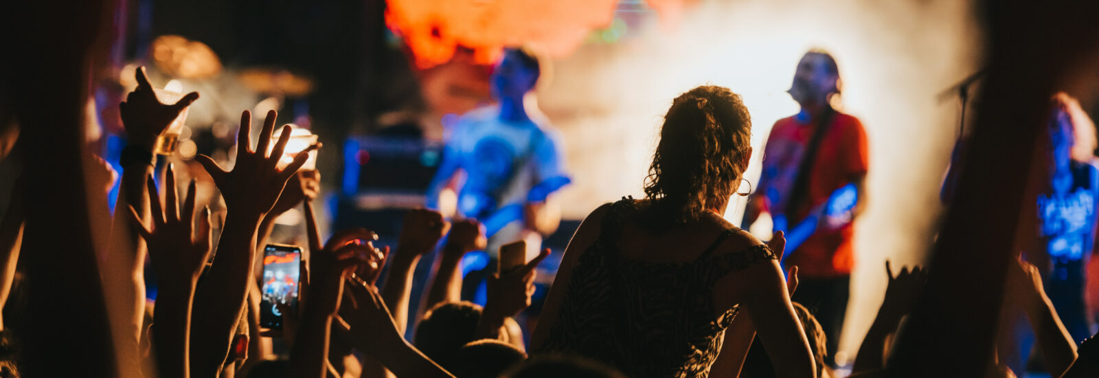 A band performing to crowd