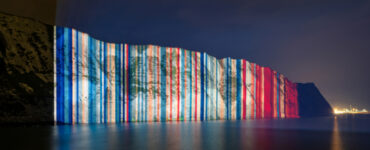 Climate stripes projected onto the White Cliffs of Dover