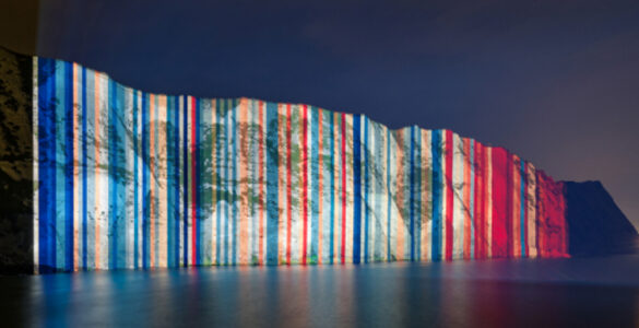 Climate stripes projected onto the White Cliffs of Dover