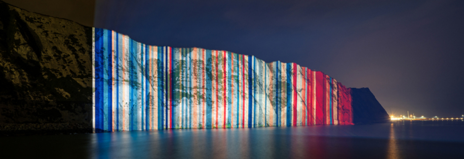 Climate stripes projected onto the White Cliffs of Dover