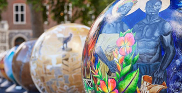A trail of globes with artwork on