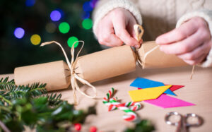 Someone making their own christmas cracker