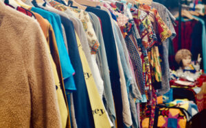 Clothes hanging in a charity shop