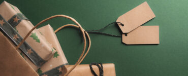 Presents wrapped in brown paper against a green background