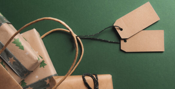 Presents wrapped in brown paper against a green background