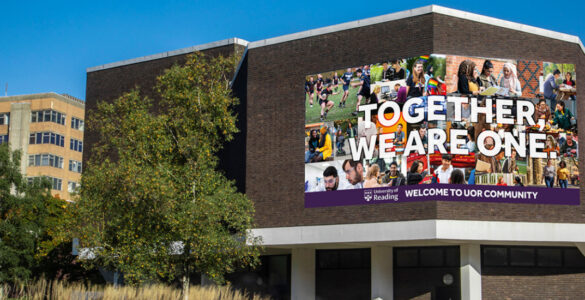 Photo of a banner on the Palmer Building, reading Together We Are One