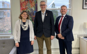 Andrew Charlton-Perez, Robert Van de Noort and Dr Natalie Harvey smiling at the camera