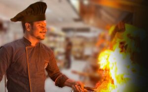 Chef cooking with a flaming pan