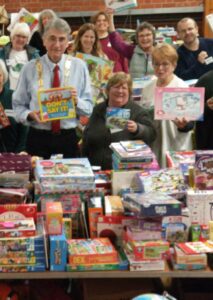 Laura at the Toys and Teens Appeal with the present donated