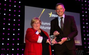 Laura Windisch receiving her award from Chancellor Paul Lindley
