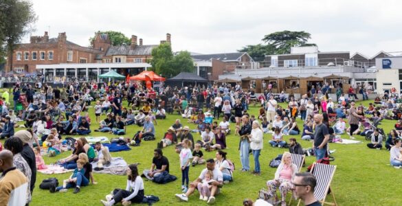 Crowd of people on a field at the Community Festival